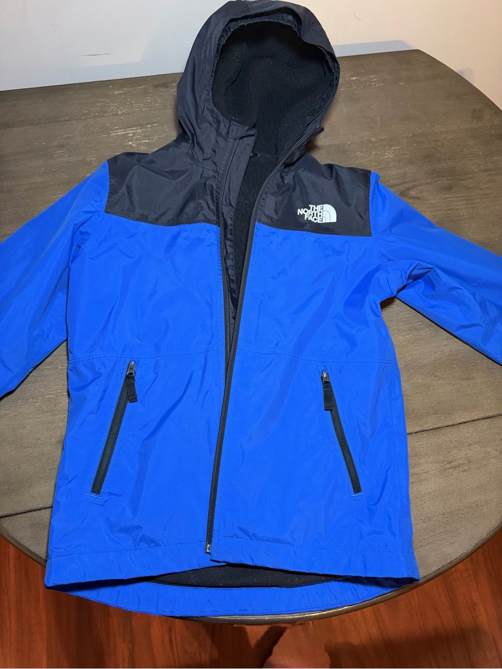 The North Face Kids Blue and Black Hooded Rain Jacket